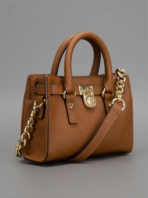 michael kors purse light brown leather|Michael Kors small brown purse.